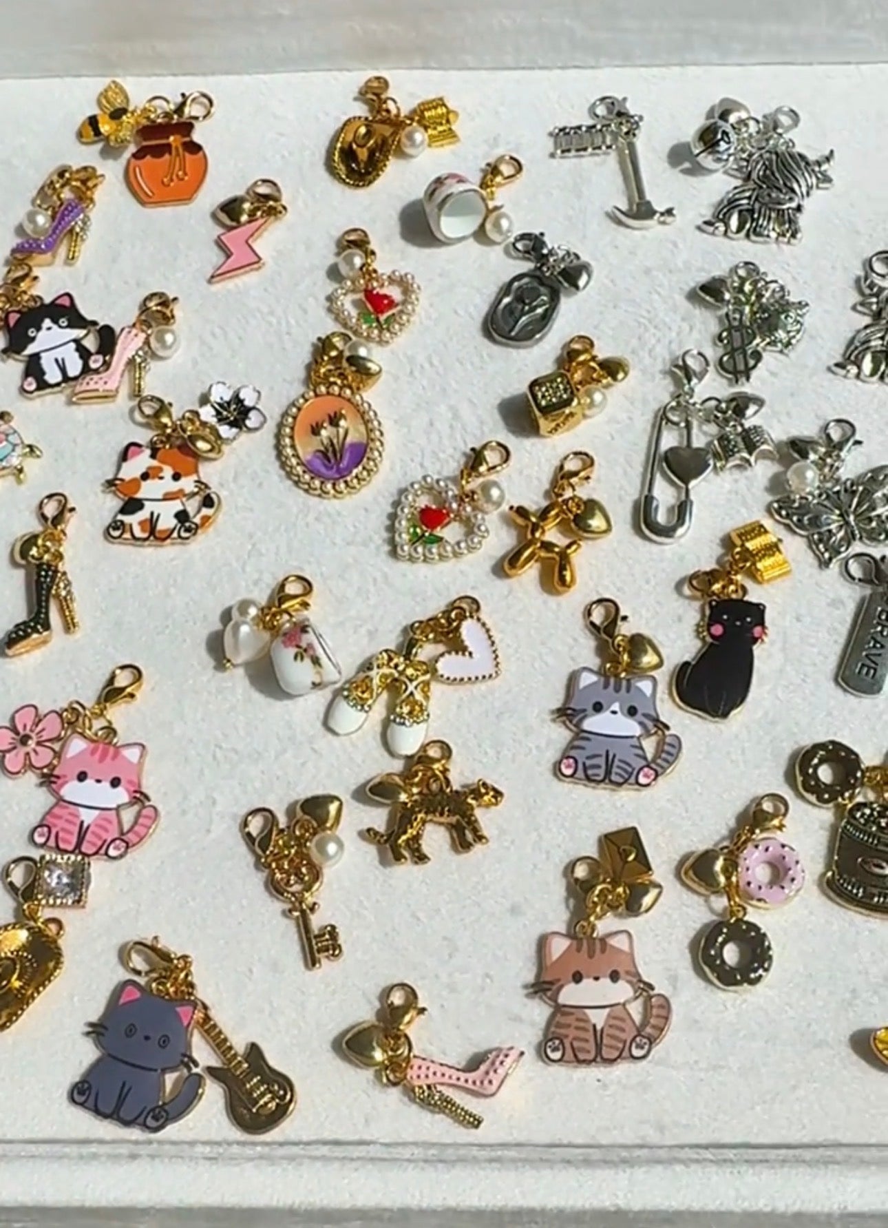 various mini charms gold and silver in many different themes