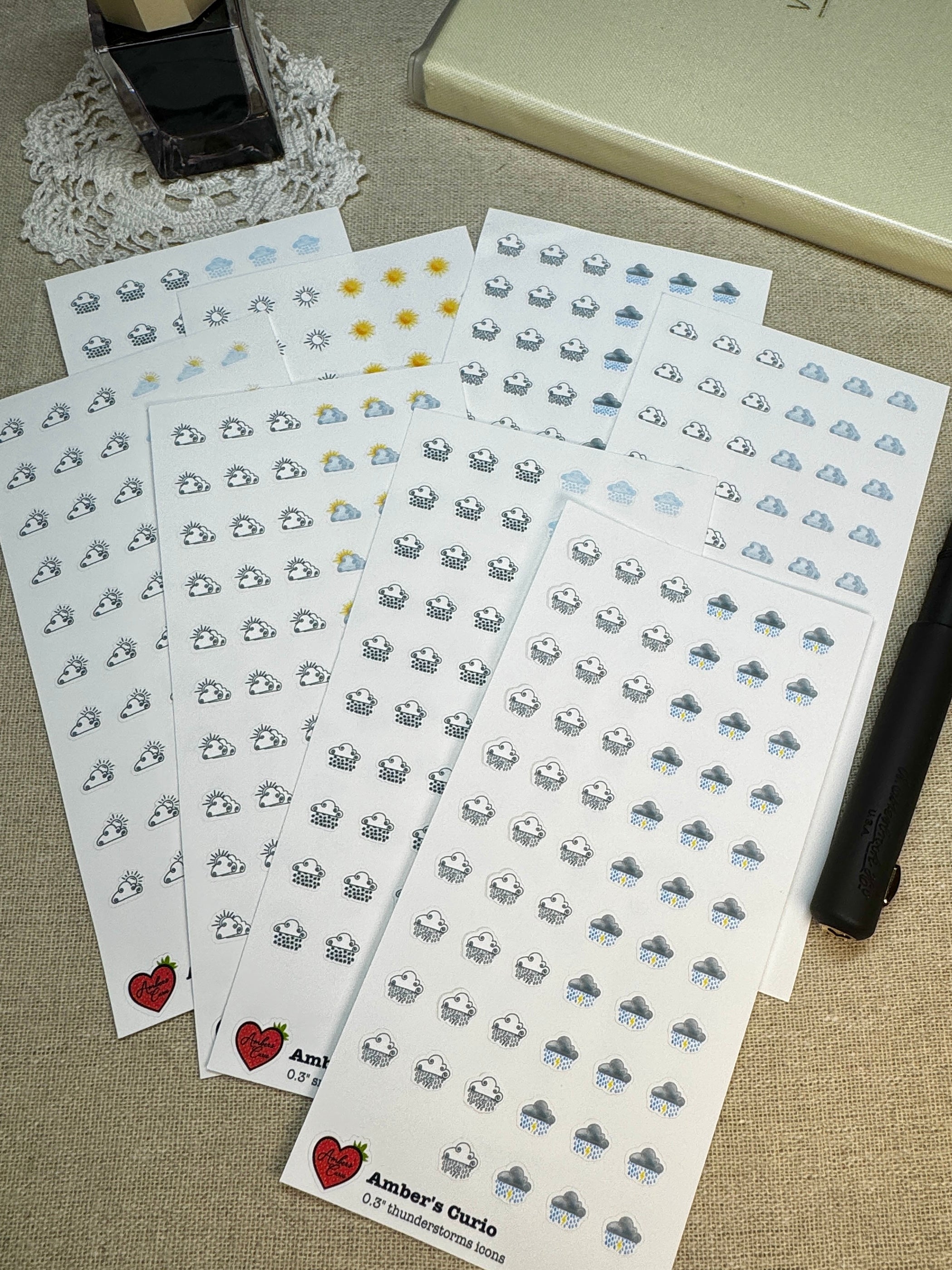 Sticker sheets of decorative weather icons printed on premium matte sticker paper.