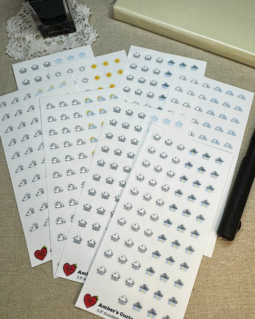 Sticker sheets of decorative weather icons printed on premium matte sticker paper.