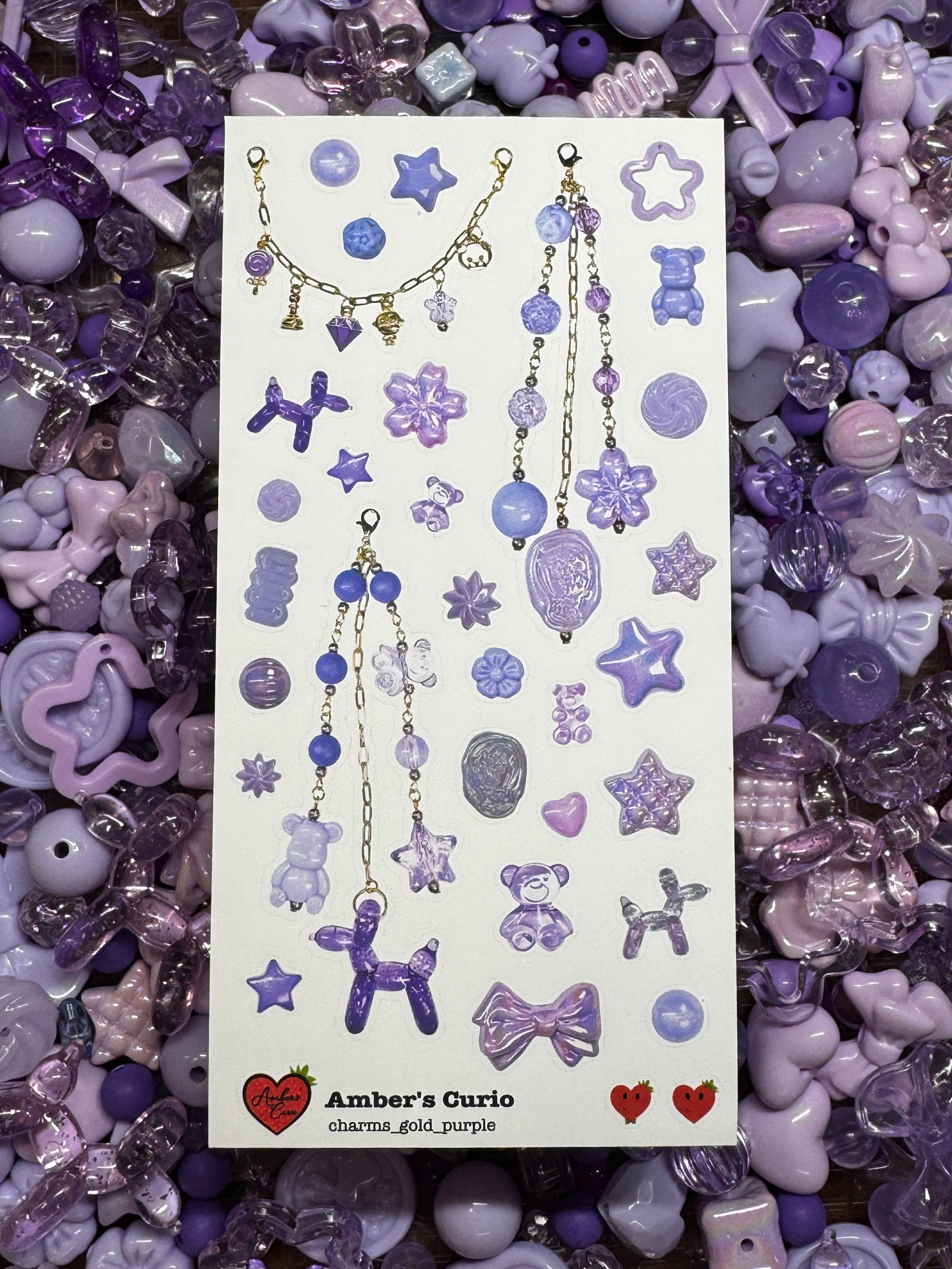 Sticker sheets of photographed purple beads and charms printed on premium matte paper photographed on top of beads